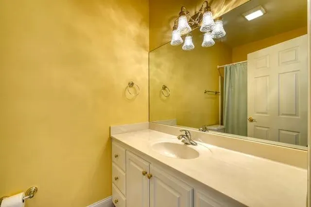 a kitchen with a stove and chairs