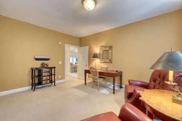 a view of a livingroom with furniture and a ceiling fan