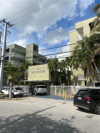 a view of parking with cars parked