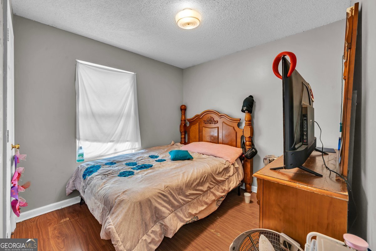 707 East 3rd Avenue Cordele, GA 31015 - Photo 11 of 21 a bedroom with a bed and a window
