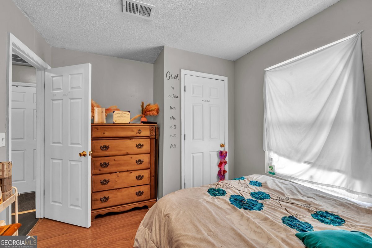 707 East 3rd Avenue Cordele, GA 31015 - Photo 12 of 21 a bedroom with a bed and a window