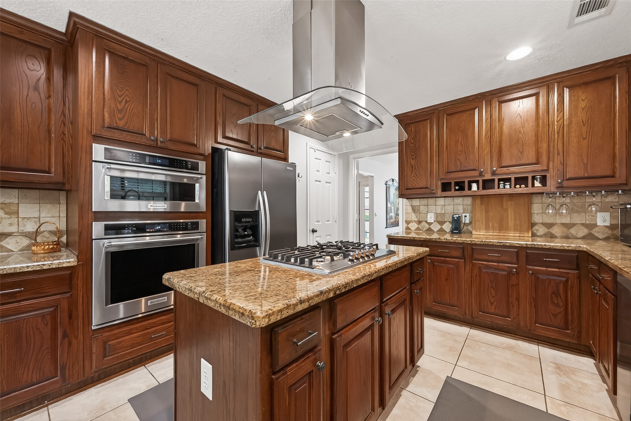 18526 Fawn Run Lane Houston, TX 77084 - Photo 10 of 47 a kitchen with stainless steel appliances granite countertop a sink stove and refrigerator