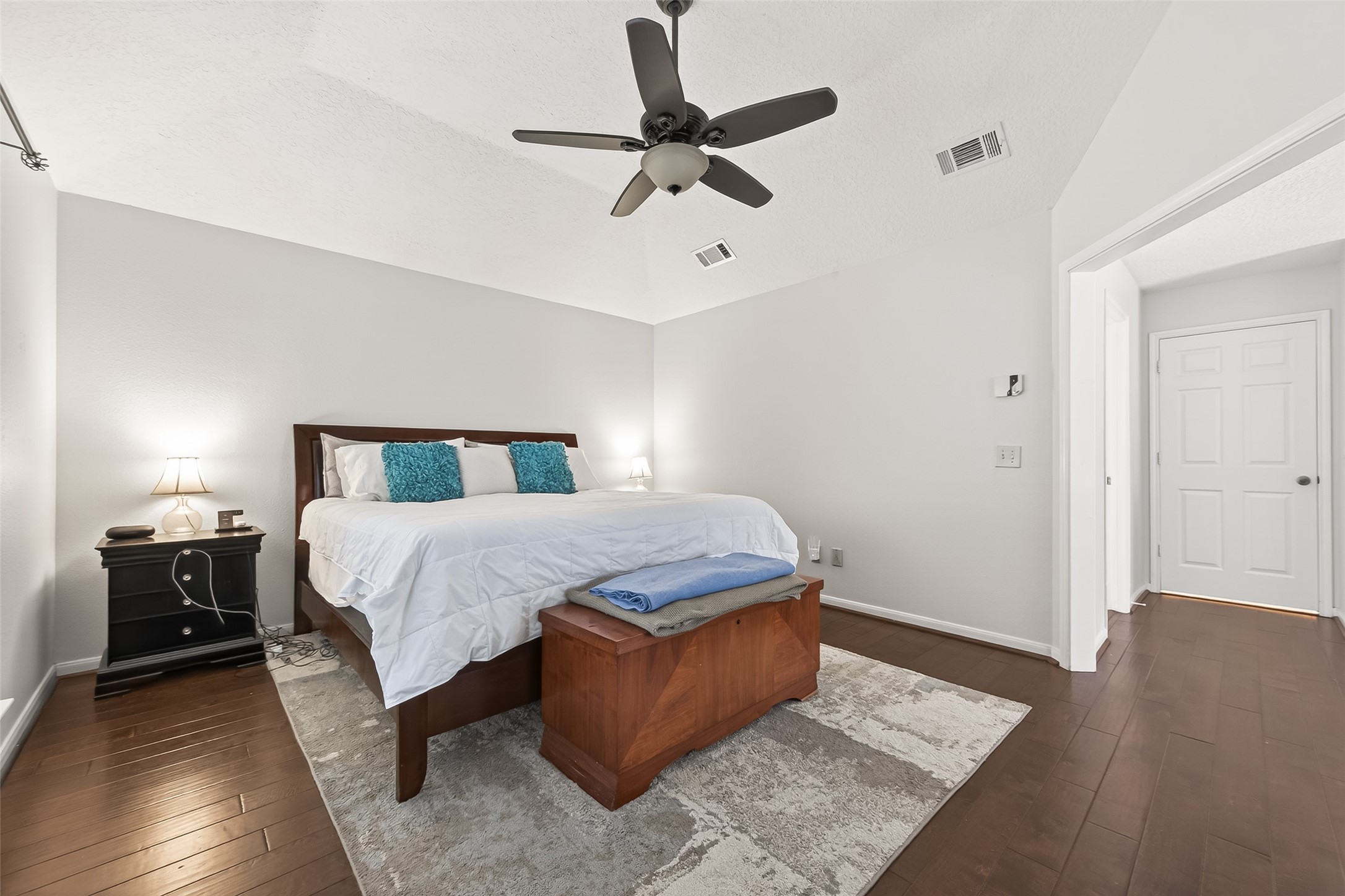 18526 Fawn Run Lane Houston, TX 77084 - Photo 17 of 47 a bedroom with a bed and wooden floor