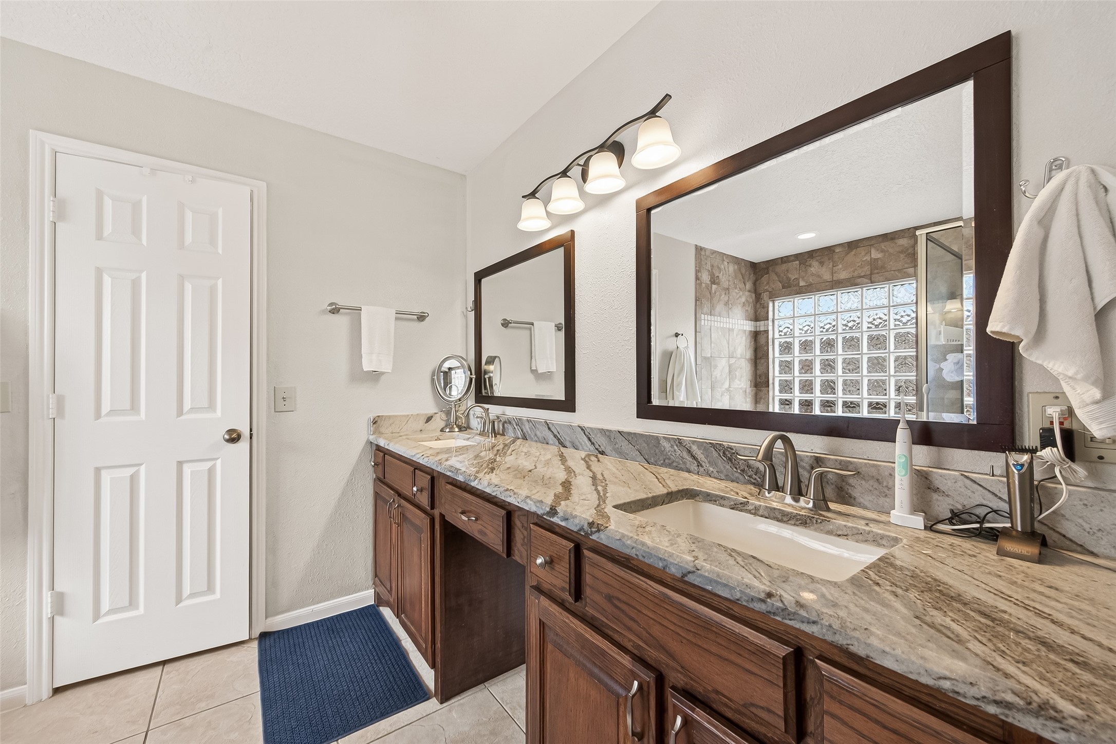 18526 Fawn Run Lane Houston, TX 77084 - Photo 20 of 47 a bathroom with a granite countertop sink and a mirror