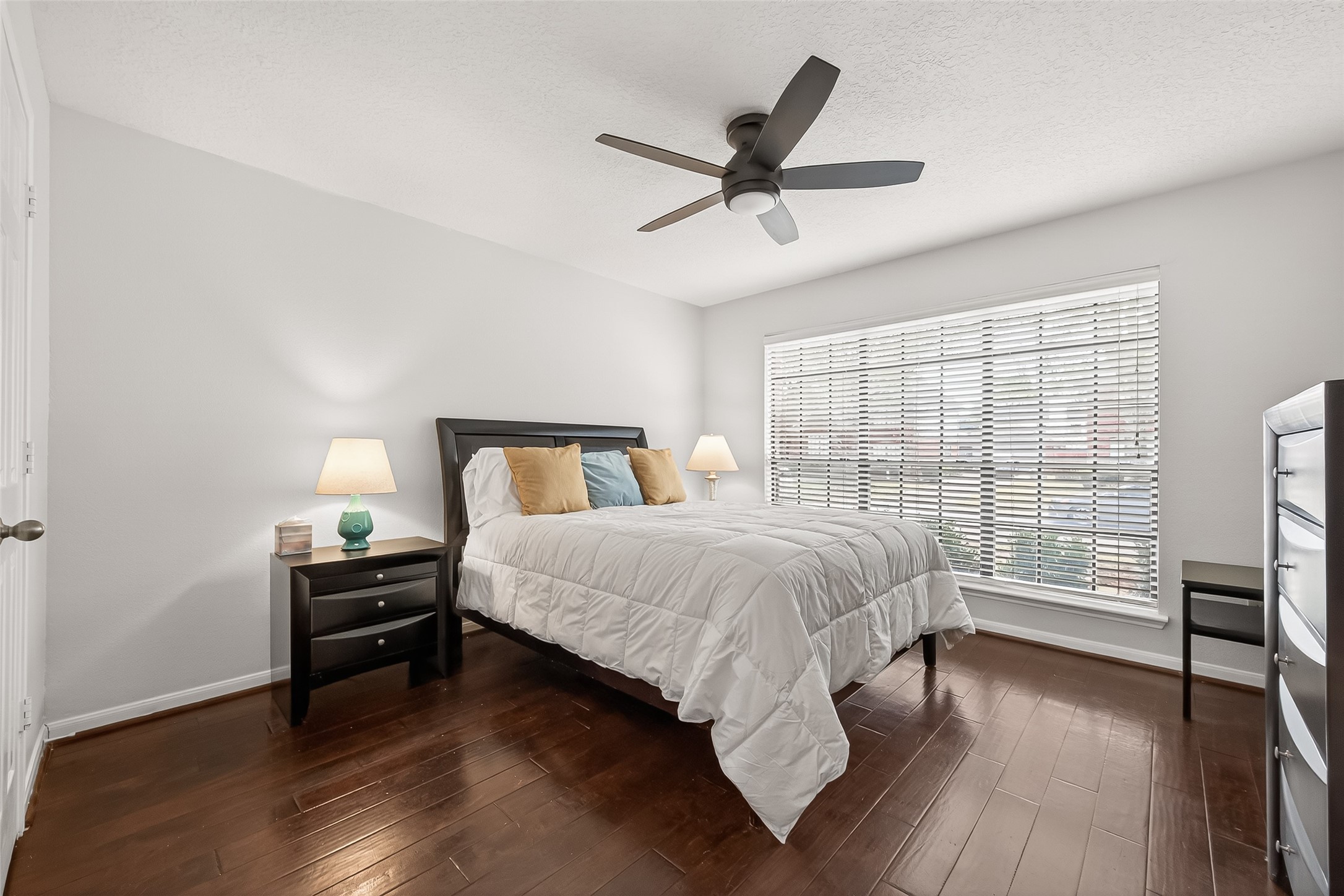 18526 Fawn Run Lane Houston, TX 77084 - Photo 24 of 47 a bedroom with a bed and wooden floor