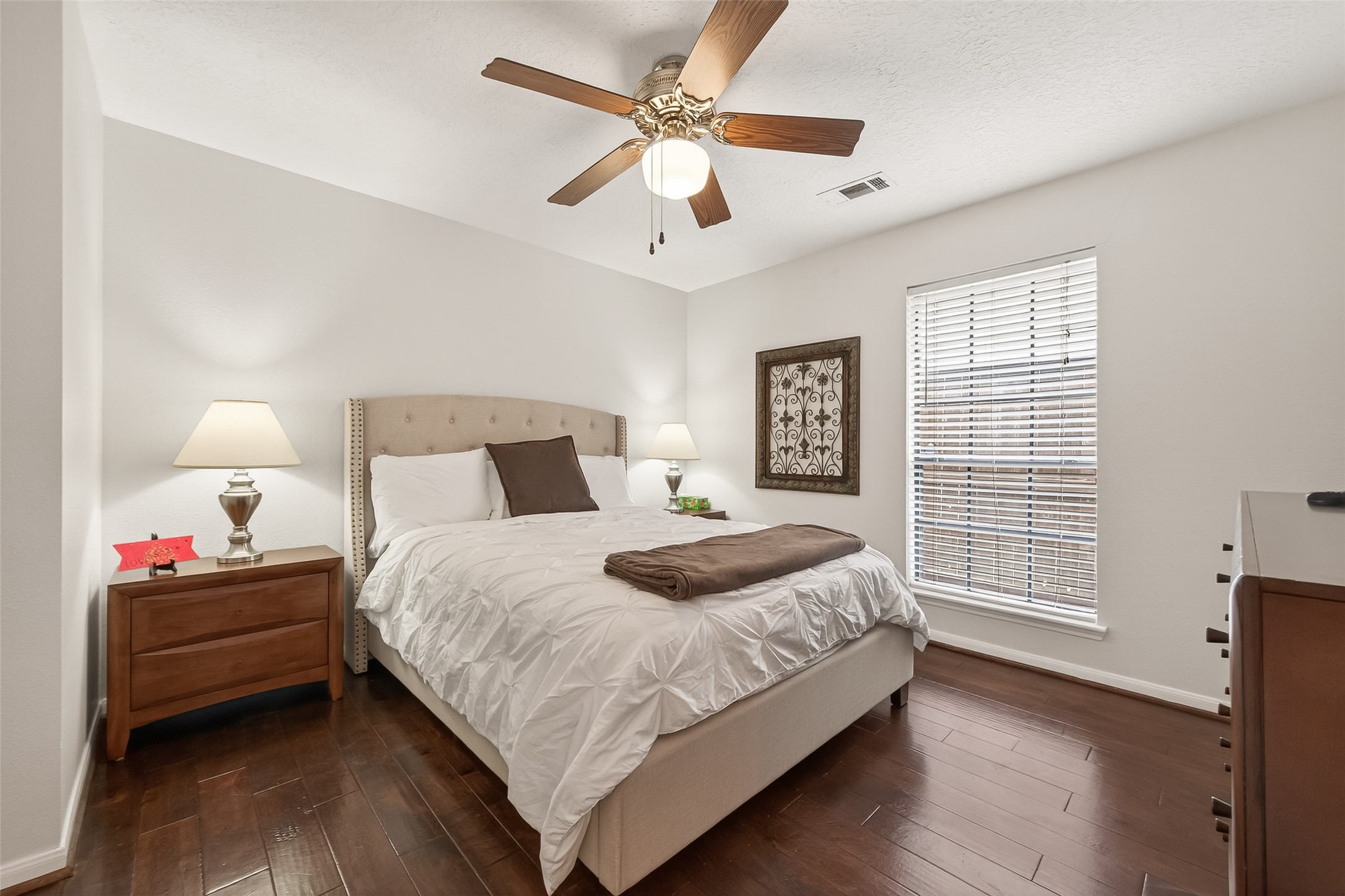 18526 Fawn Run Lane Houston, TX 77084 - Photo 25 of 47 a bedroom with a bed chandelier and a window