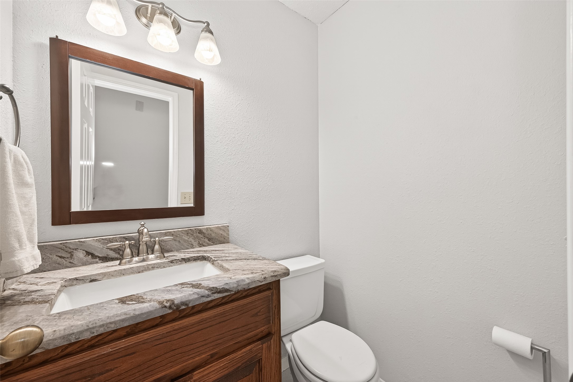 18526 Fawn Run Lane Houston, TX 77084 - Photo 30 of 47 a bathroom with a granite countertop toilet sink and mirror