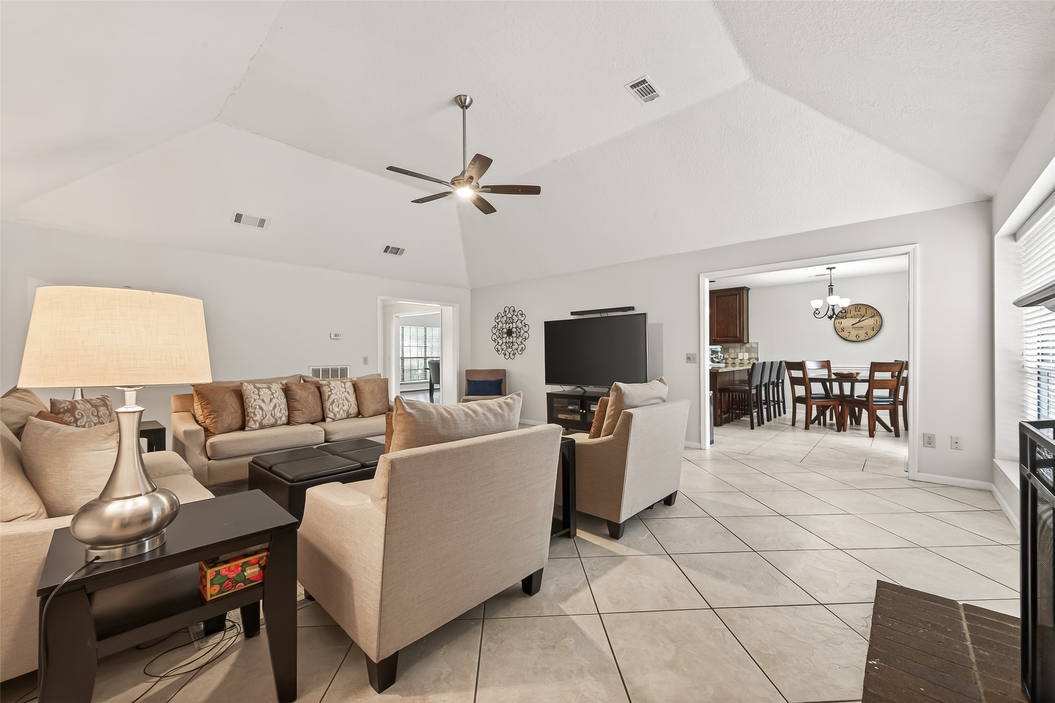 18526 Fawn Run Lane Houston, TX 77084 - Photo 7 of 47 a living room with furniture a dining table and a flat screen tv