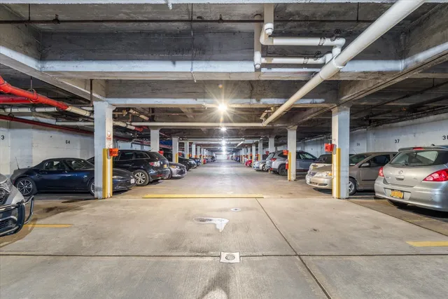a view of parking garage with cars