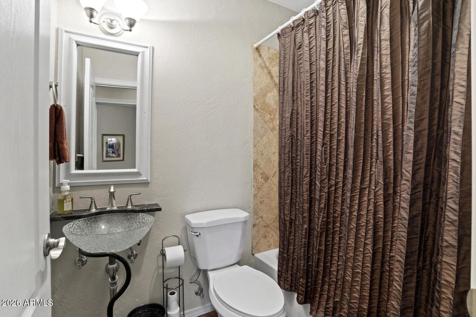 415 East Rim Estates Trail Payson, AZ 85541 - Photo 30 of 76 a bathroom with a sink a toilet and mirror