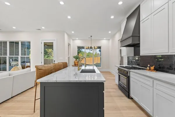 a kitchen with a stove and a refrigerator
