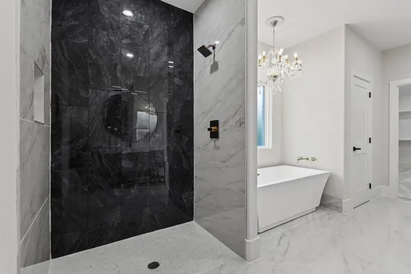 a en suite bathroom with a double vanity sink and a mirror