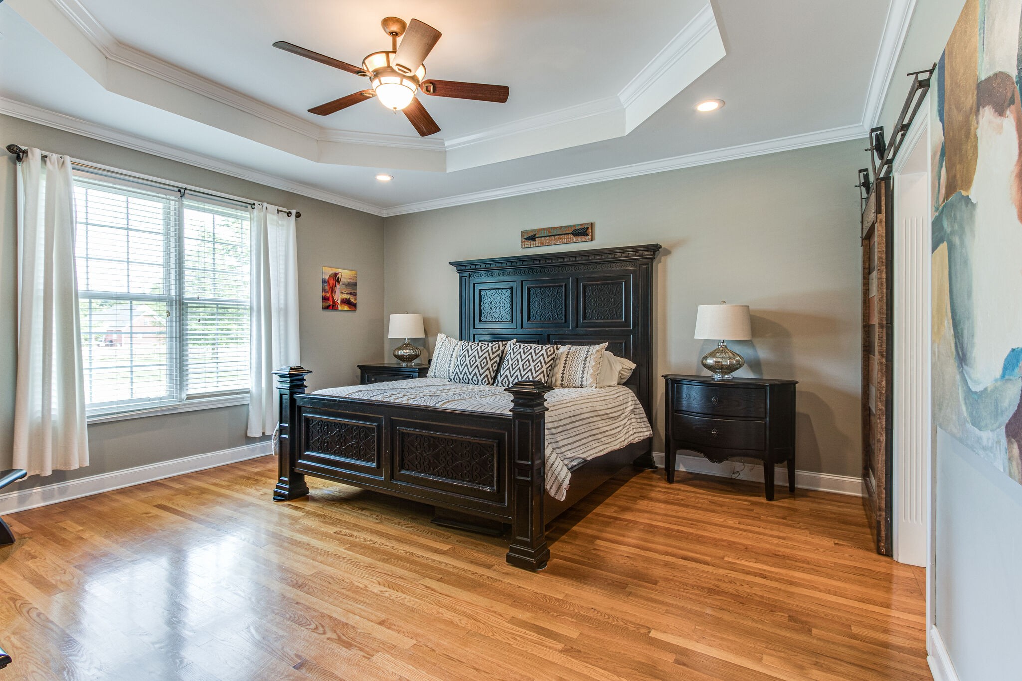 881 Urban Farms Road Manchester, TN 37355 - Photo 13 of 49 a bedroom with a bed chandelier and a window