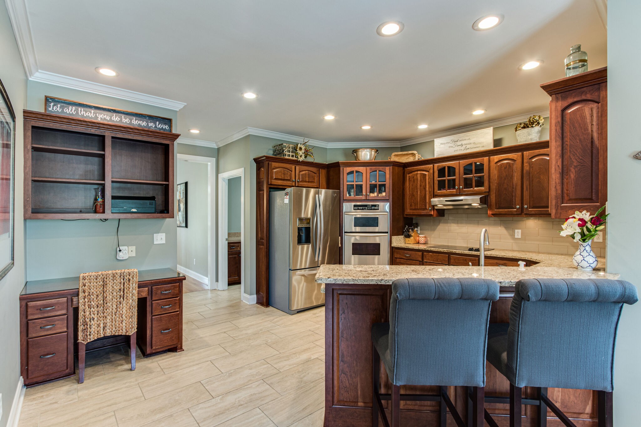 881 Urban Farms Road Manchester, TN 37355 - Photo 24 of 49 a kitchen with stainless steel appliances granite countertop a table chairs sink and cabinets