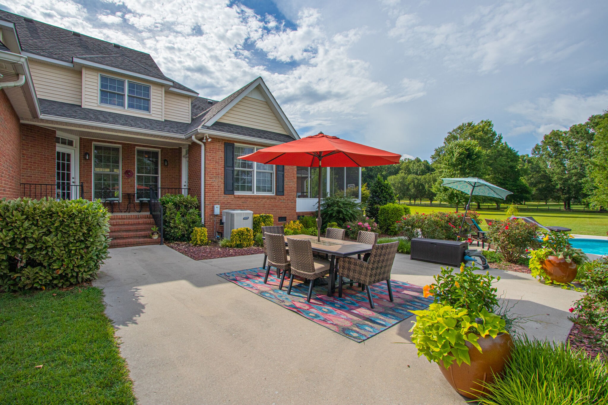 881 Urban Farms Road Manchester, TN 37355 - Photo 38 of 49 a view of a house with backyard sitting area and garden