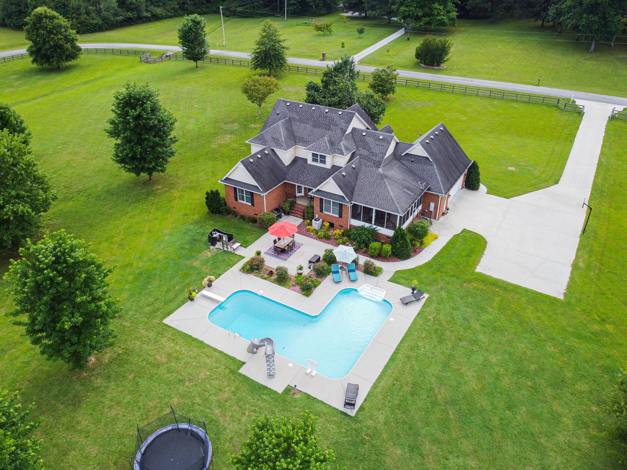 881 Urban Farms Road Manchester, TN 37355 - Photo 48 of 49 an aerial view of a house with garden space and swimming pool