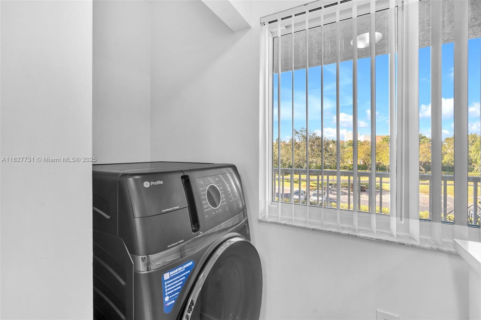 9525 Weldon Circle, Unit H305 Tamarac, FL 33321 - Photo 18 of 26 a view of washer and dryer