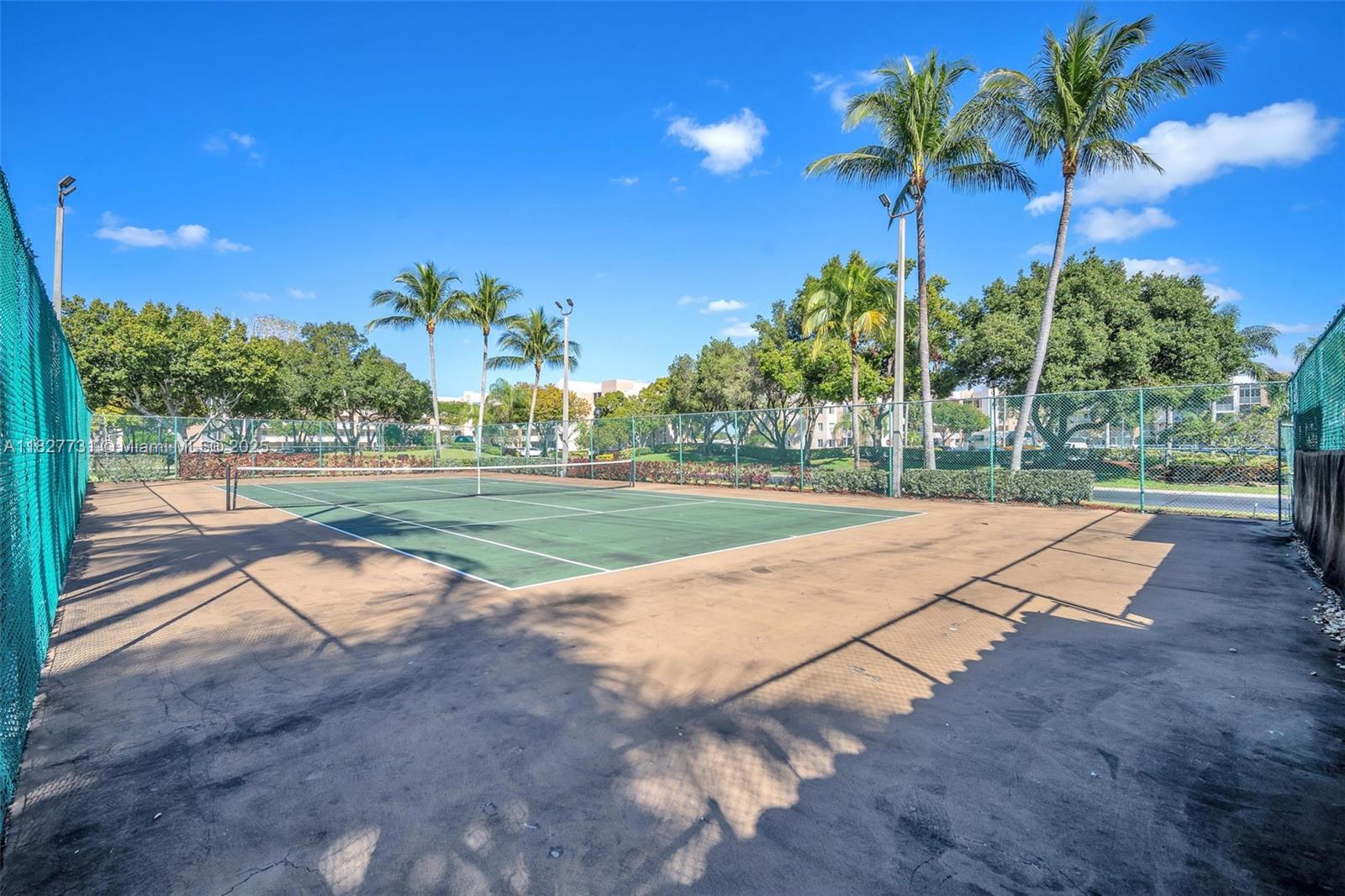 9525 Weldon Circle, Unit H305 Tamarac, FL 33321 - Photo 24 of 26 a view of a park with palm trees