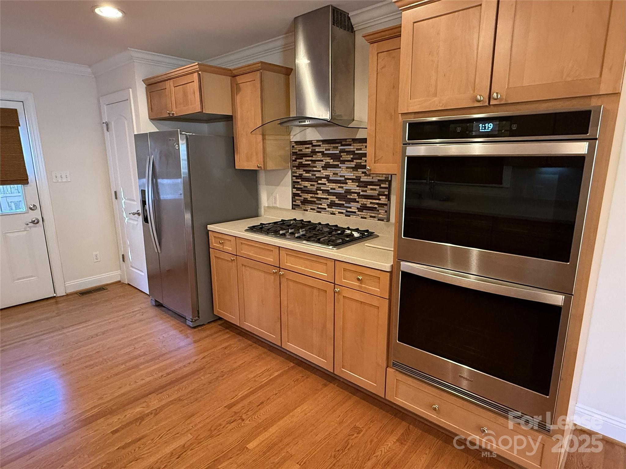 350 Melbourne Court Charlotte, NC 28209 - Photo 11 of 22 a kitchen with cabinets and steel stainless steel appliances