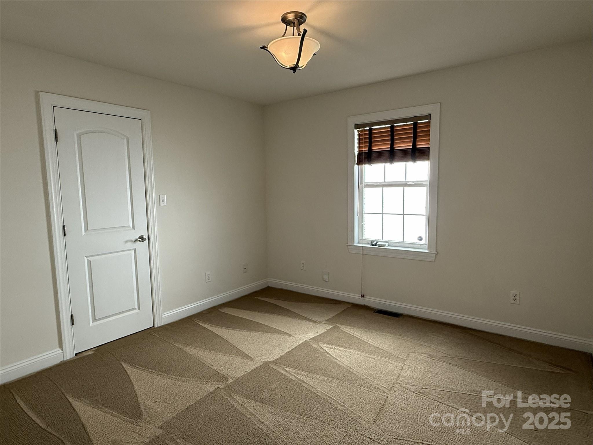 350 Melbourne Court Charlotte, NC 28209 - Photo 13 of 22 a view of an empty room with a window