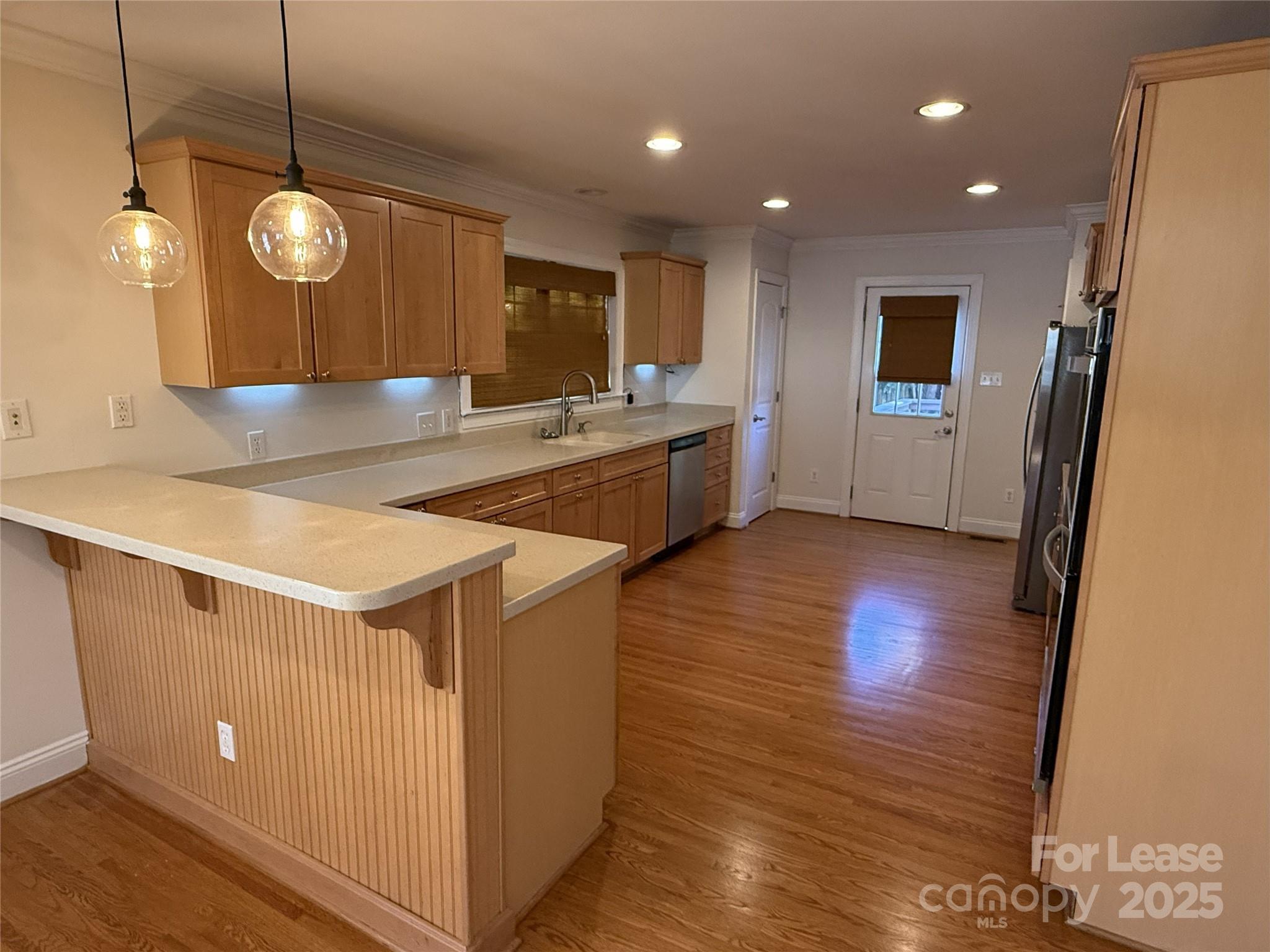 350 Melbourne Court Charlotte, NC 28209 - Photo 6 of 22 a view of a kitchen counter space with wooden floor
