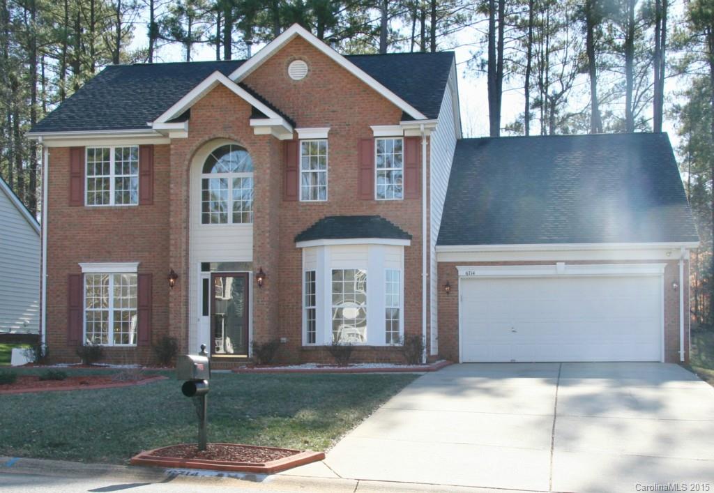 6714 Reedy Creek Road, Unit 2 Charlotte, NC 28215 - Photo 1 of 23 a front view of a house with garden