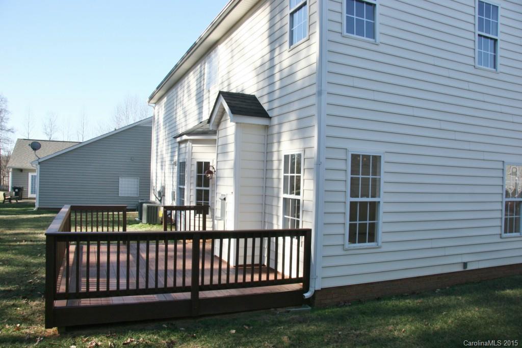 6714 Reedy Creek Road, Unit 2 Charlotte, NC 28215 - Photo 23 of 23 a view of a house with a yard