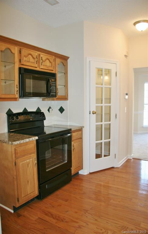 6714 Reedy Creek Road, Unit 2 Charlotte, NC 28215 - Photo 4 of 23 a kitchen with stainless steel appliances a stove and a microwave