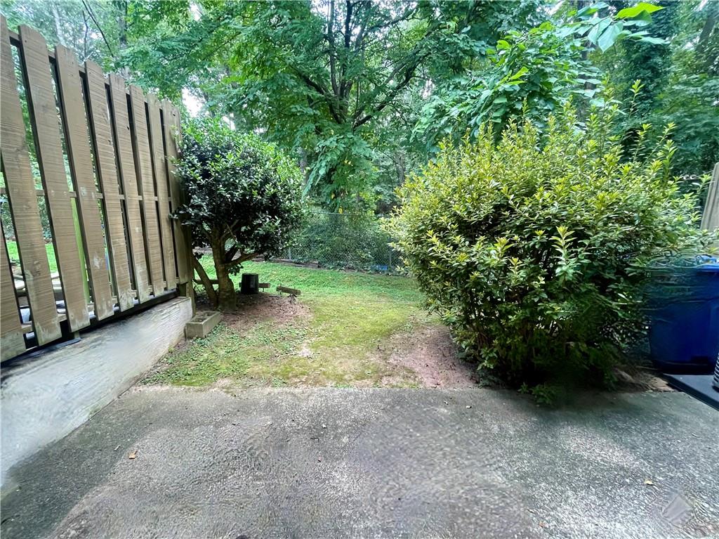 3653 Cobble Mill Lane Clarkston, GA 30021 - Photo 1 of 1 a backyard of a house with lots of green space