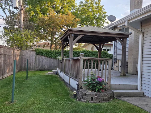 a view of a deck with a table and a chairs