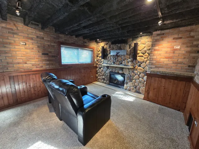 a outdoor living space with patio furniture and a fireplace