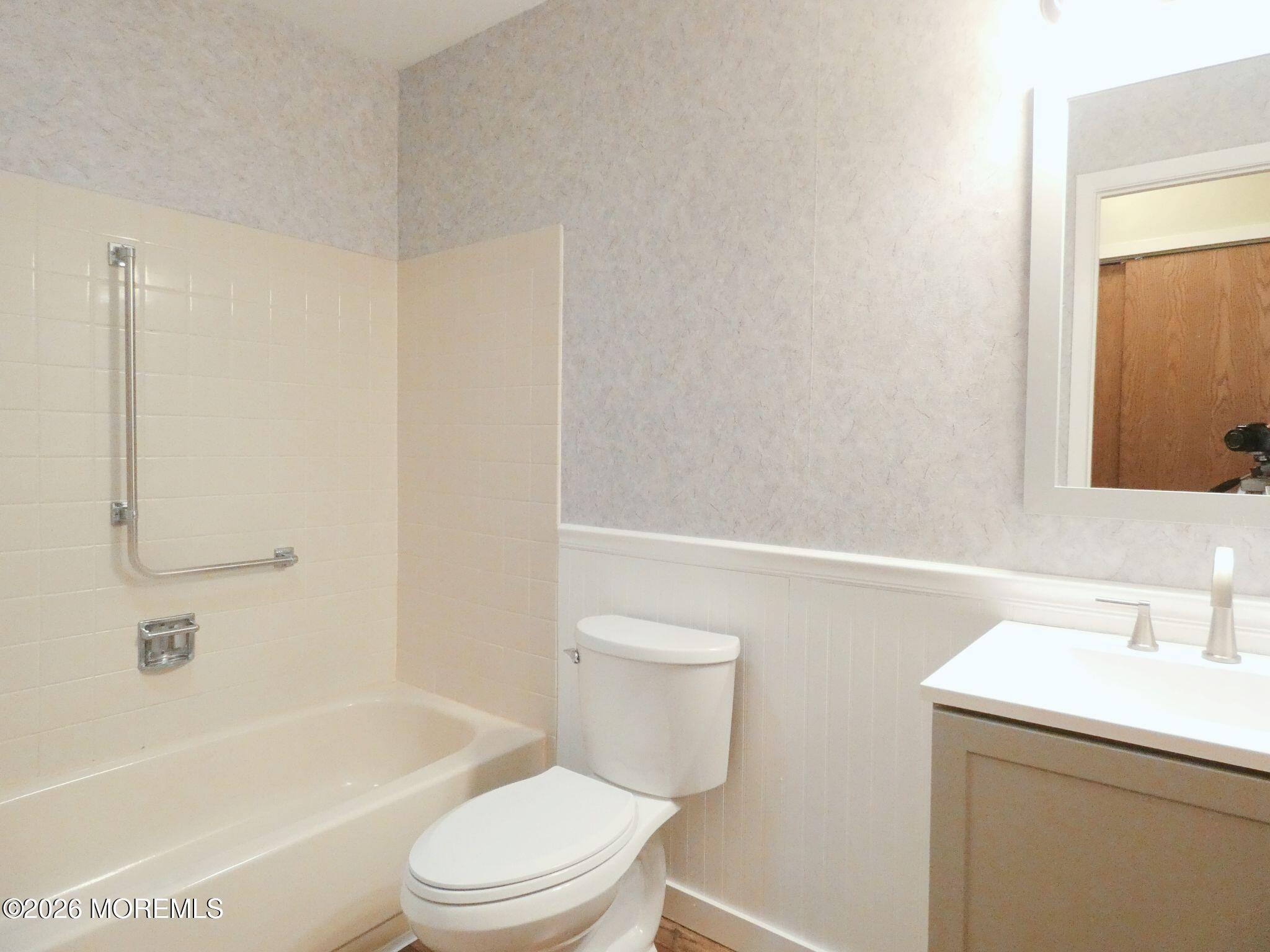 33D Medford Road, Unit A Manchester Township, NJ 08759 - Photo 19 of 24 a bathroom with a sink a toilet and shower