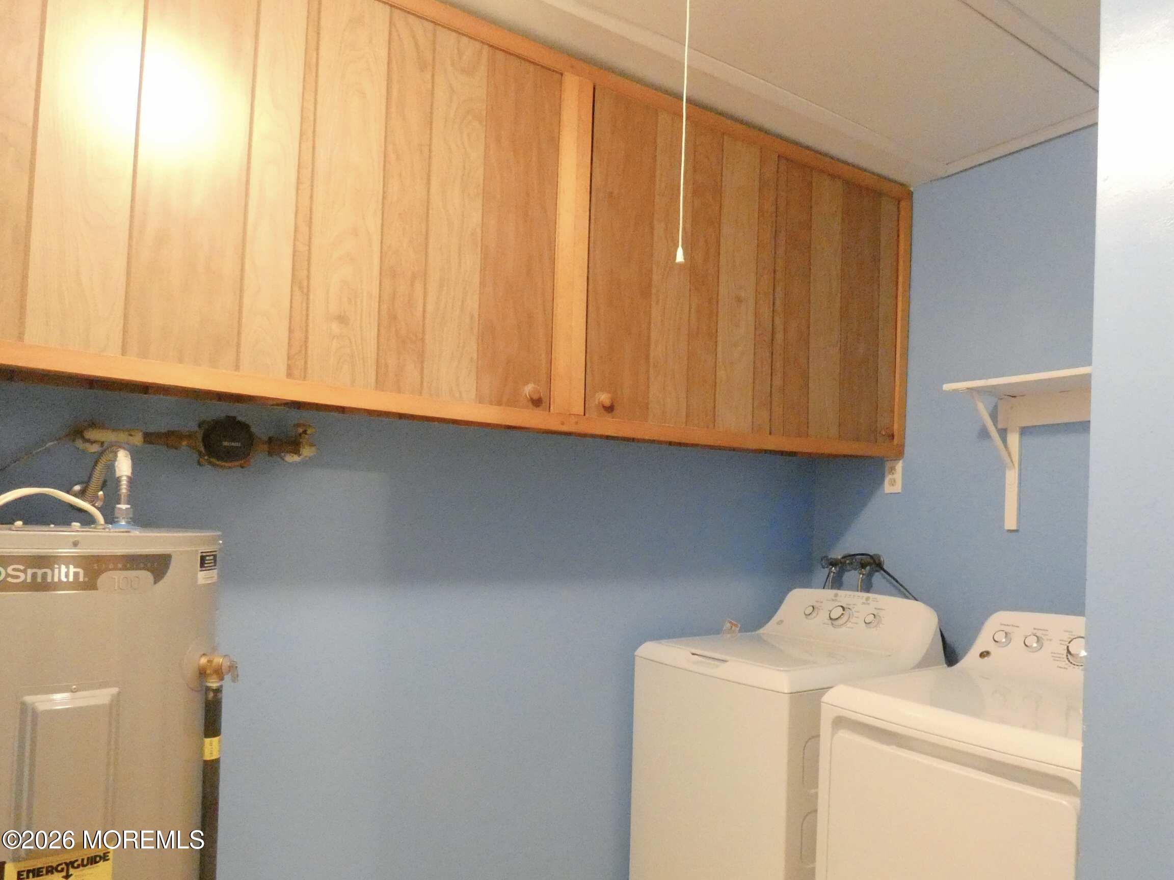 33D Medford Road, Unit A Manchester Township, NJ 08759 - Photo 21 of 24 a utility room with dryer and washer