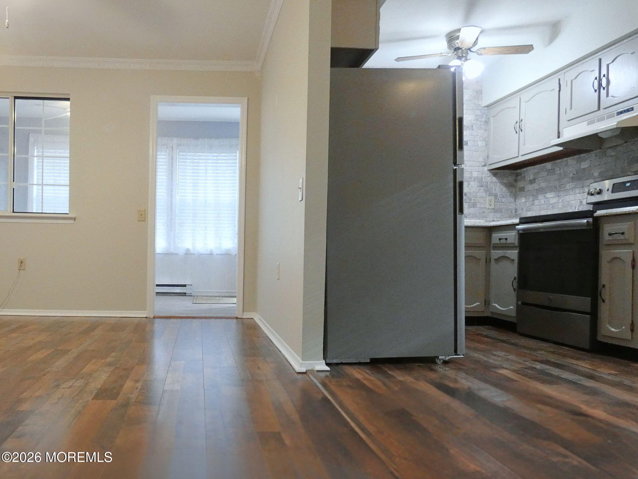 33D Medford Road, Unit A Manchester Township, NJ 08759 - Photo 9 of 24 a view of an empty room with a kitchen and a window