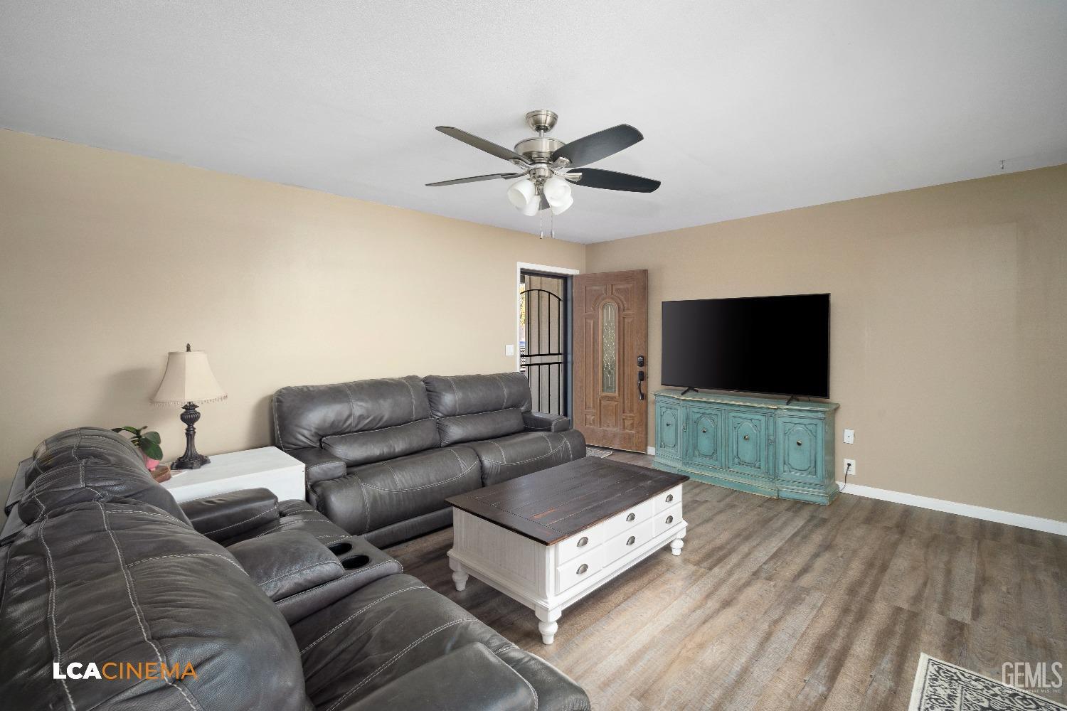 Undisclosed Address Taft, CA 93268 - Photo 5 of 20 a living room with furniture and a flat screen tv
