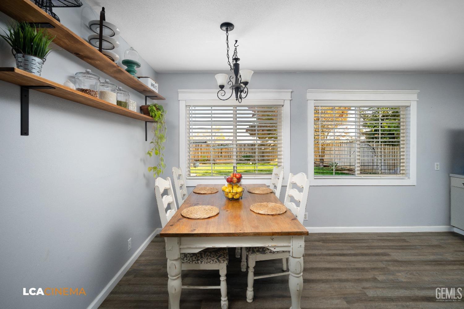 Undisclosed Address Taft, CA 93268 - Photo 6 of 20 a view of a dining room with furniture window and wooden floor
