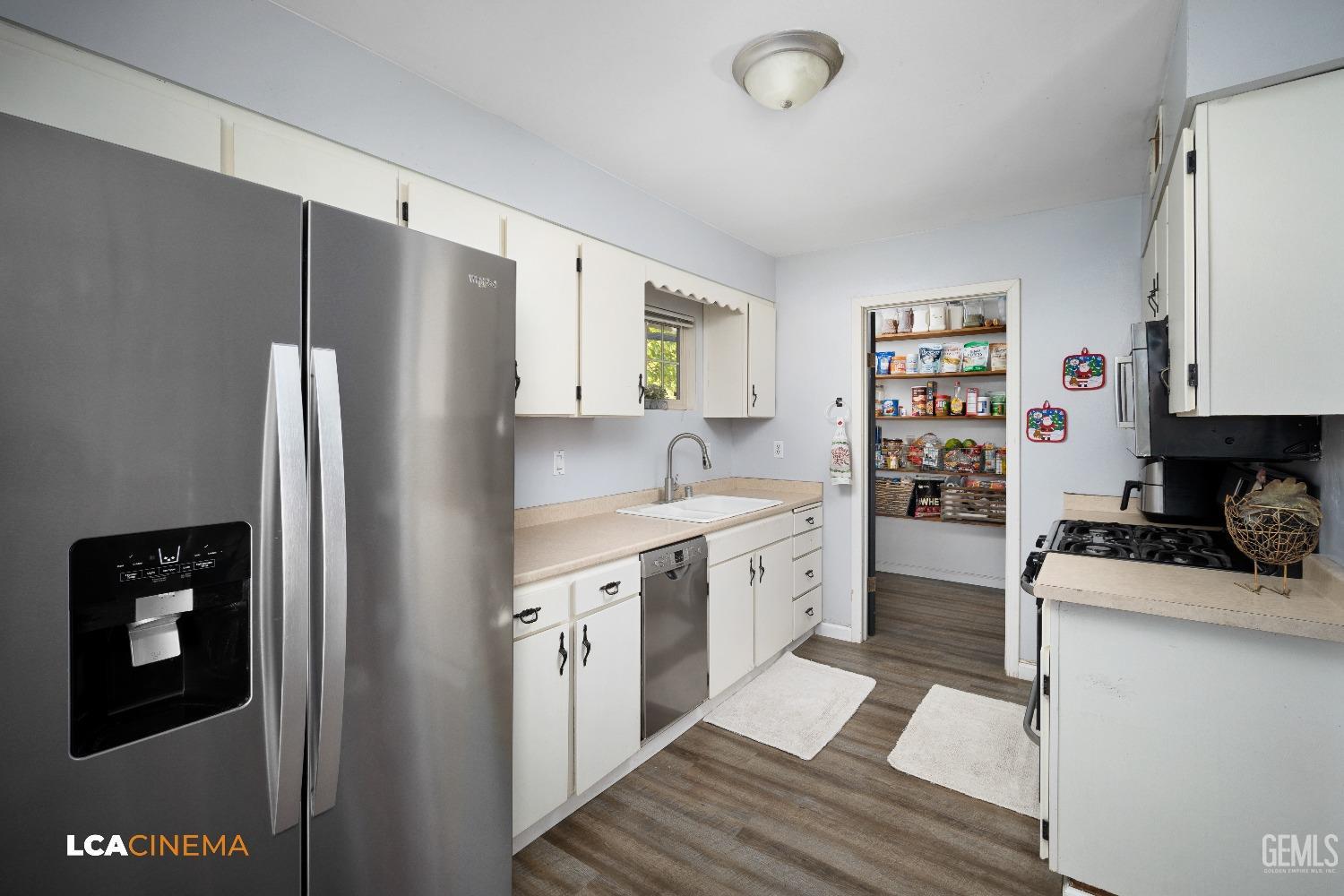 Undisclosed Address Taft, CA 93268 - Photo 7 of 20 a kitchen with stainless steel appliances granite countertop a refrigerator sink and stove