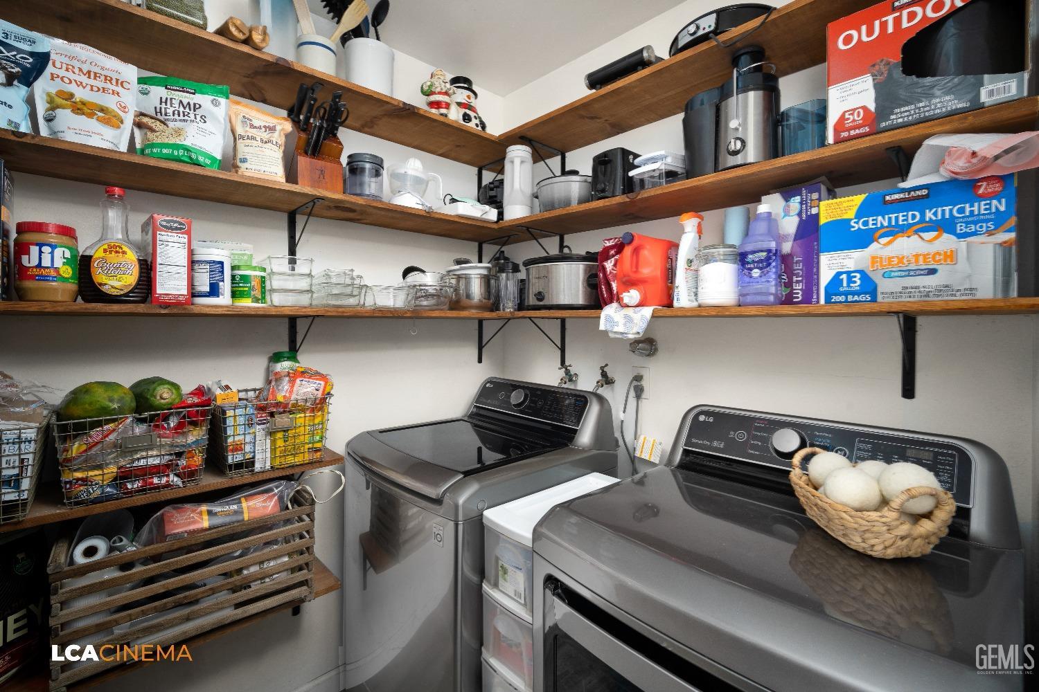 Undisclosed Address Taft, CA 93268 - Photo 9 of 20 a kitchen with lots of clutter and cabinets