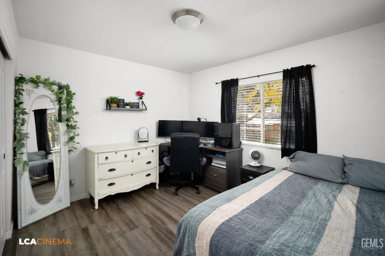 Undisclosed Address Taft, CA 93268 - Photo 10 of 20 a bedroom with a bed and a dresser