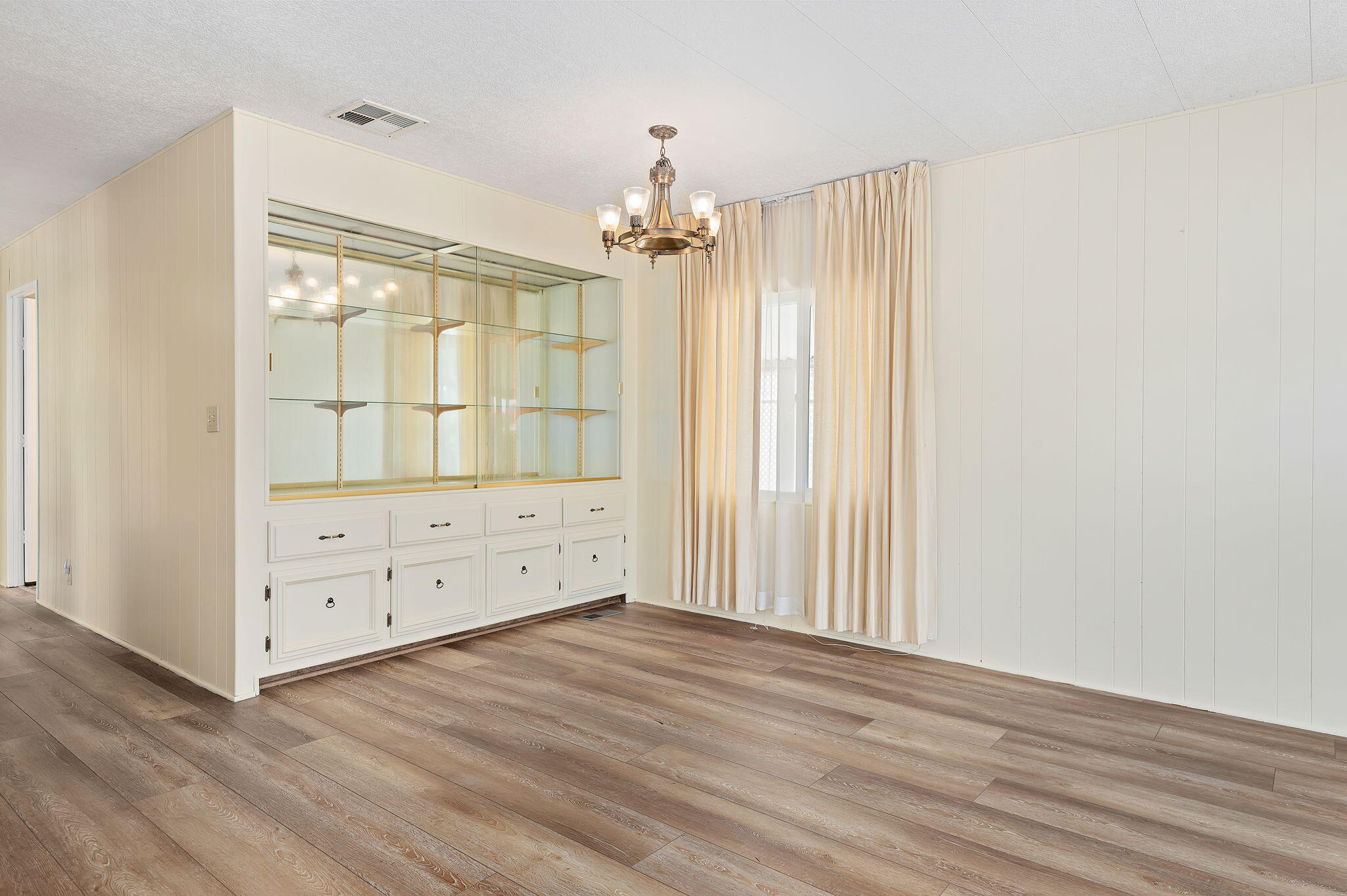 340 Old Mill Road, Unit SPC 12 Santa Barbara, CA 93110 - Photo 11 of 35 wooden floor in an empty room with a window