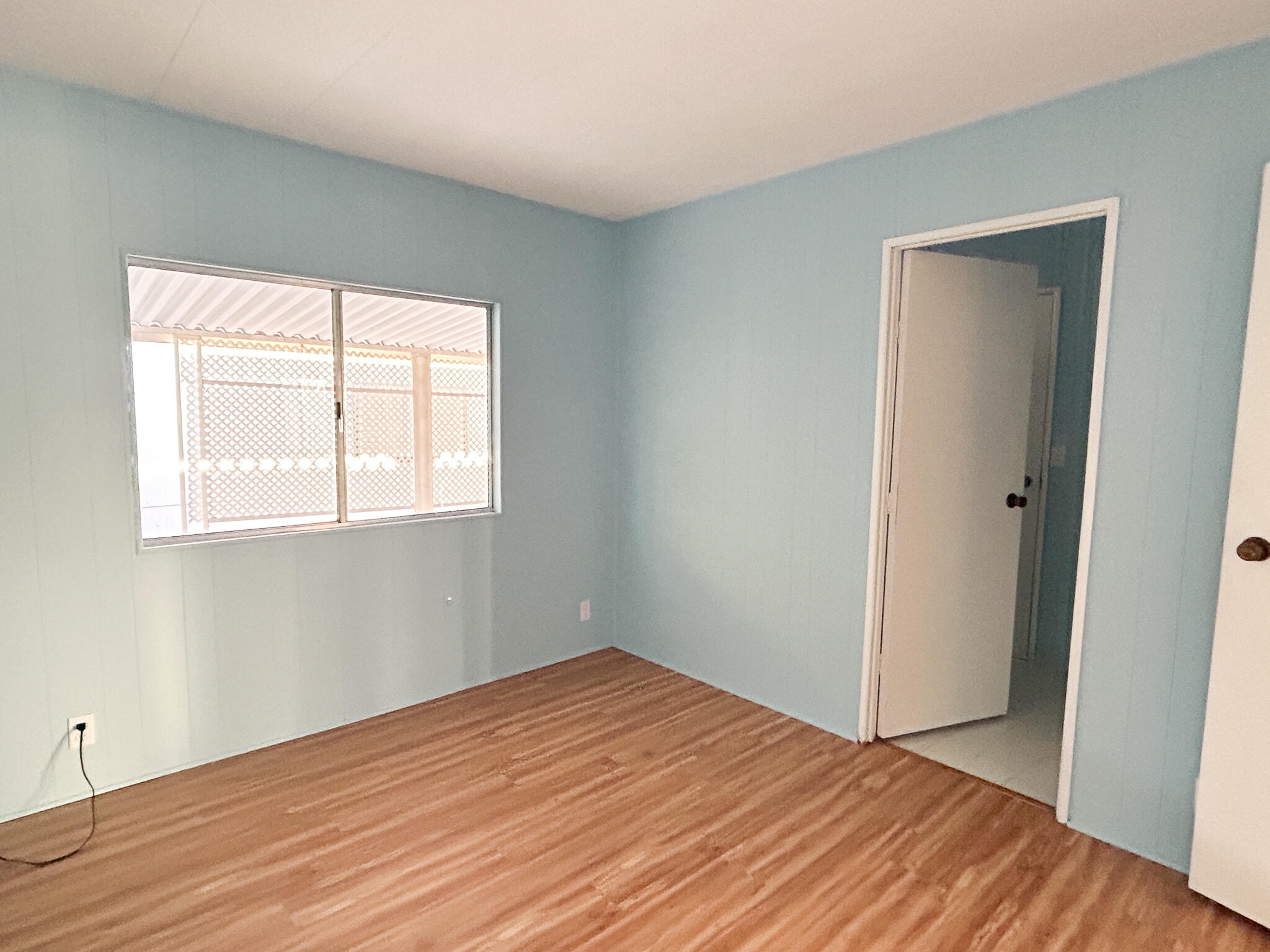 340 Old Mill Road, Unit SPC 12 Santa Barbara, CA 93110 - Photo 19 of 35 an empty room with wooden floor and windows