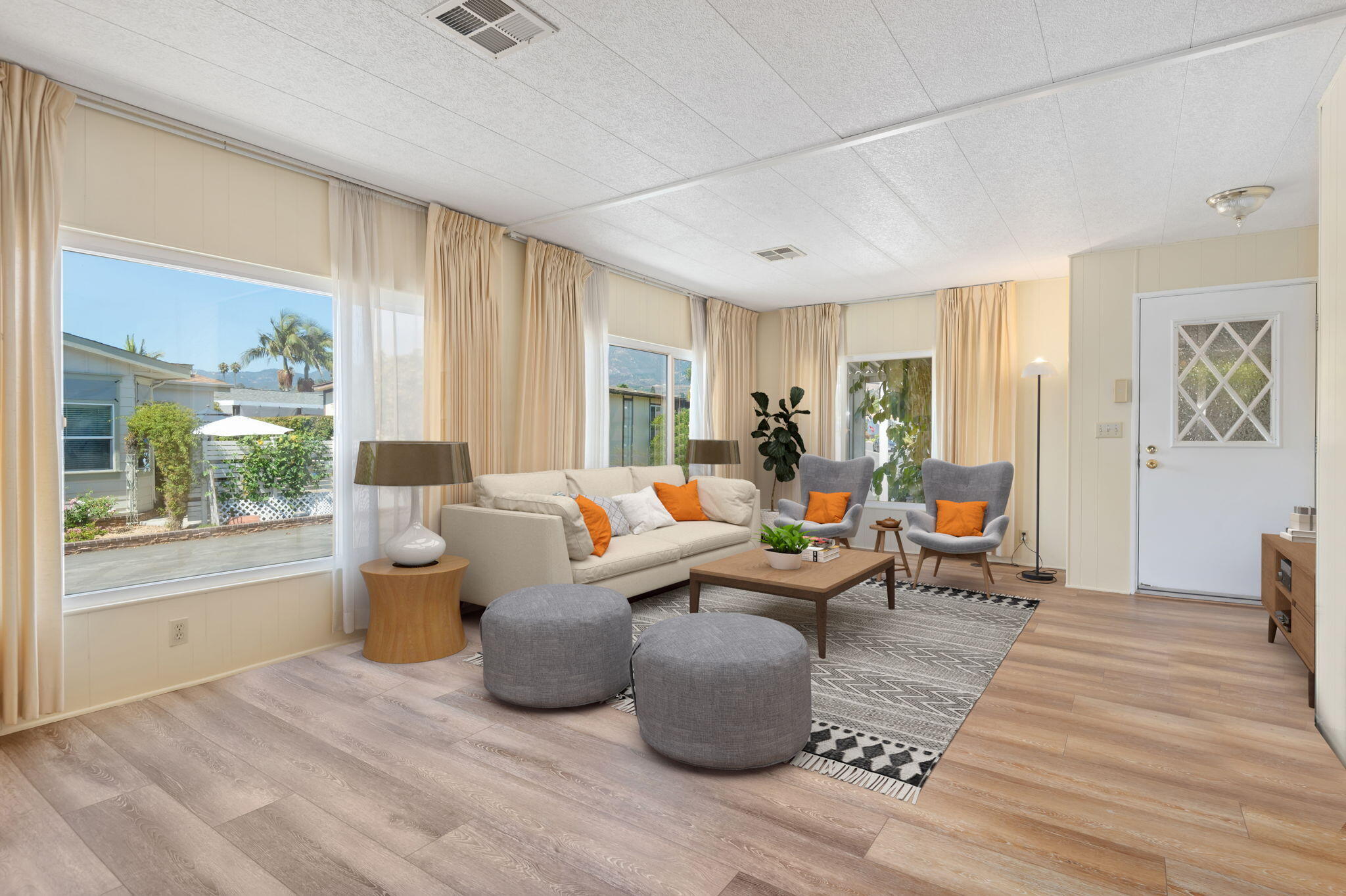 340 Old Mill Road, Unit SPC 12 Santa Barbara, CA 93110 - Photo 3 of 35 a living room with furniture a large window and wooden floor
