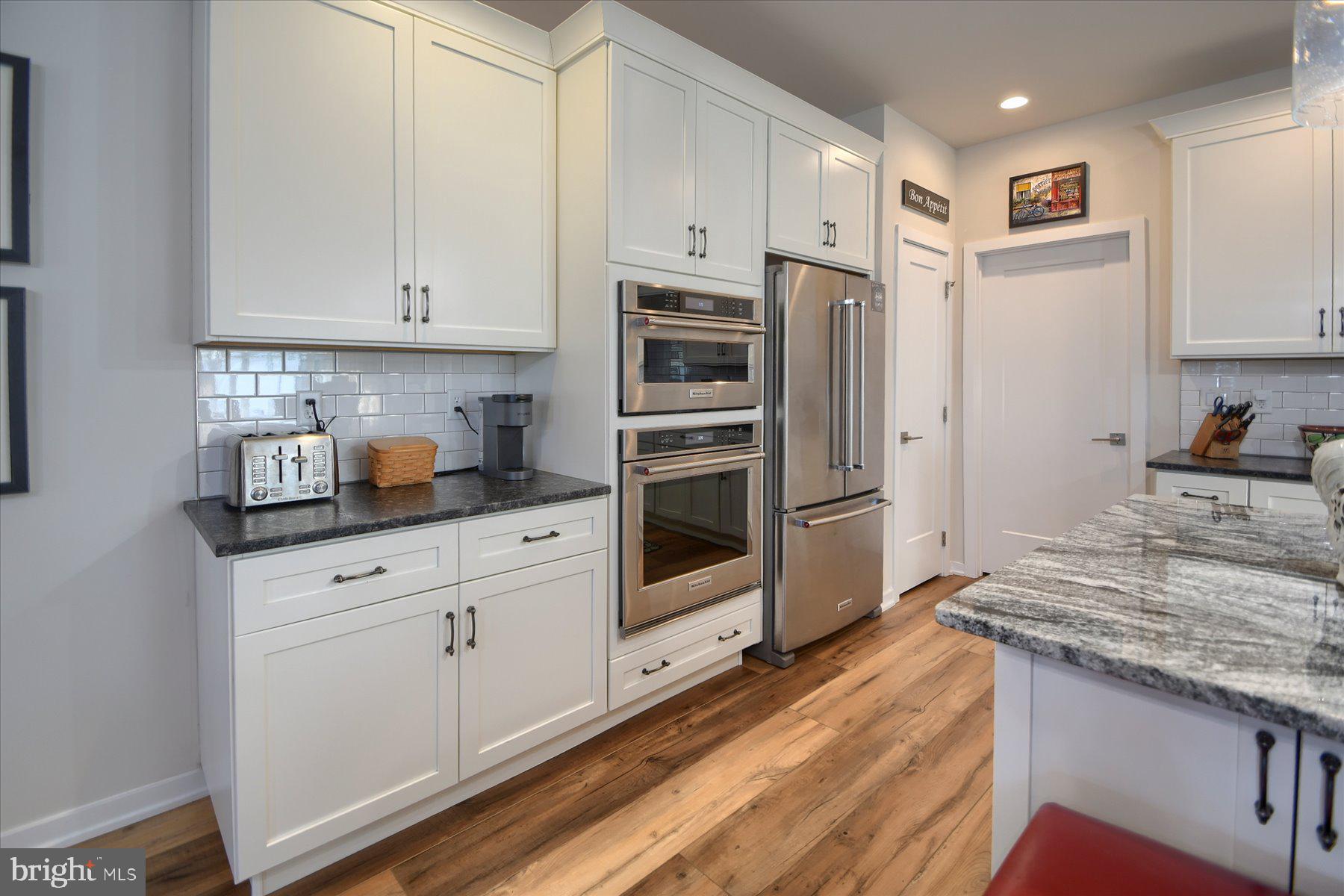 6963 Maple Drive Bath, PA 18014 - Photo 12 of 46 a kitchen with granite countertop white cabinets and stainless steel appliances