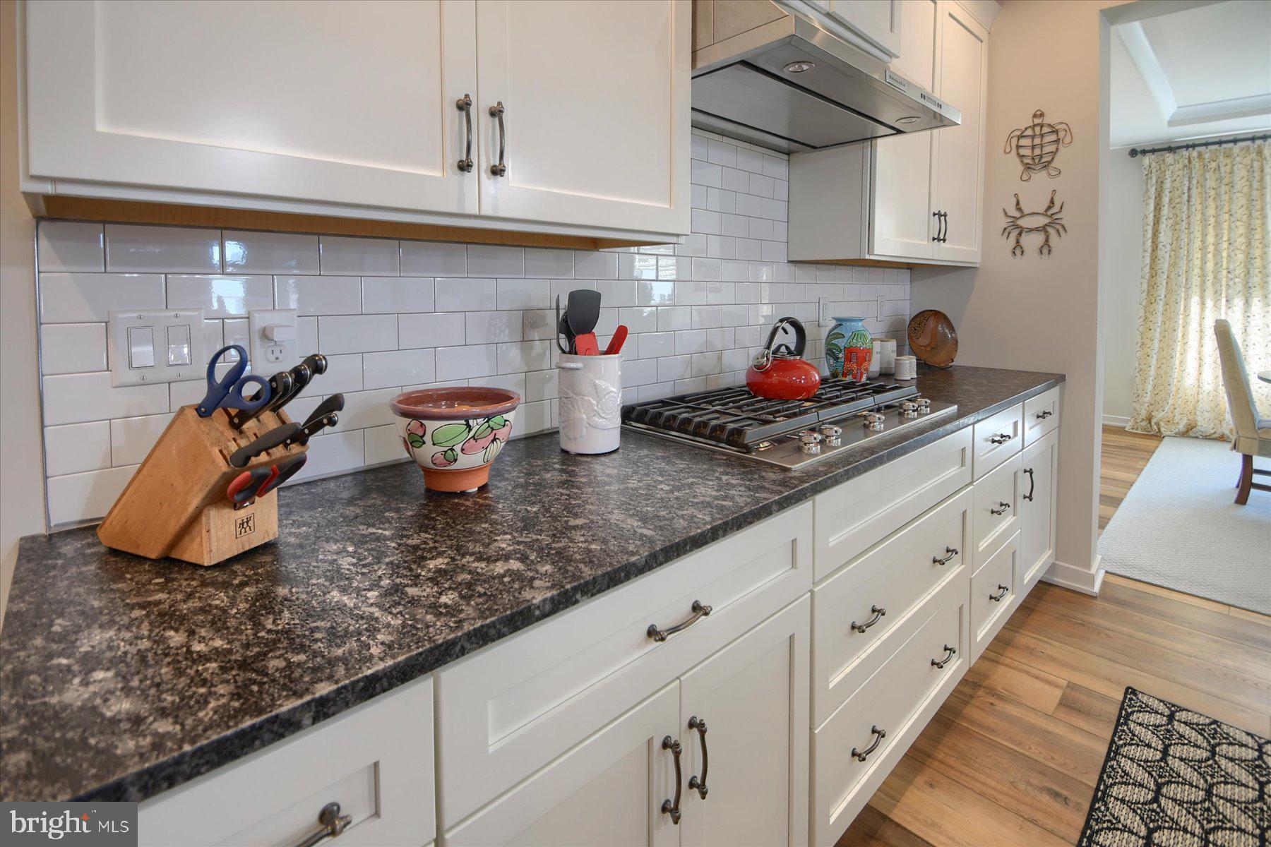 6963 Maple Drive Bath, PA 18014 - Photo 13 of 46 a kitchen with white cabinets and a sink