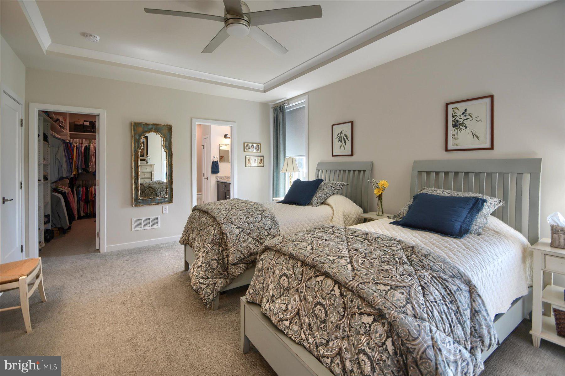 6963 Maple Drive Bath, PA 18014 - Photo 22 of 46 a bedroom with two beds and a chandelier