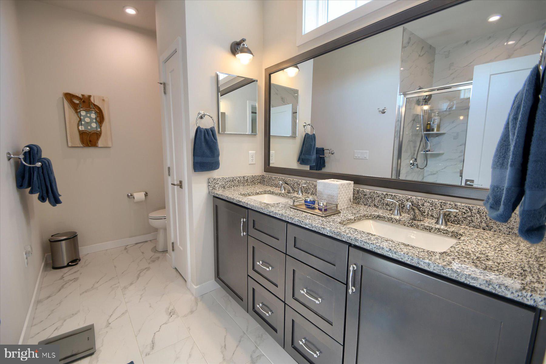 6963 Maple Drive Bath, PA 18014 - Photo 24 of 46 a bathroom with a granite countertop sink mirror and double