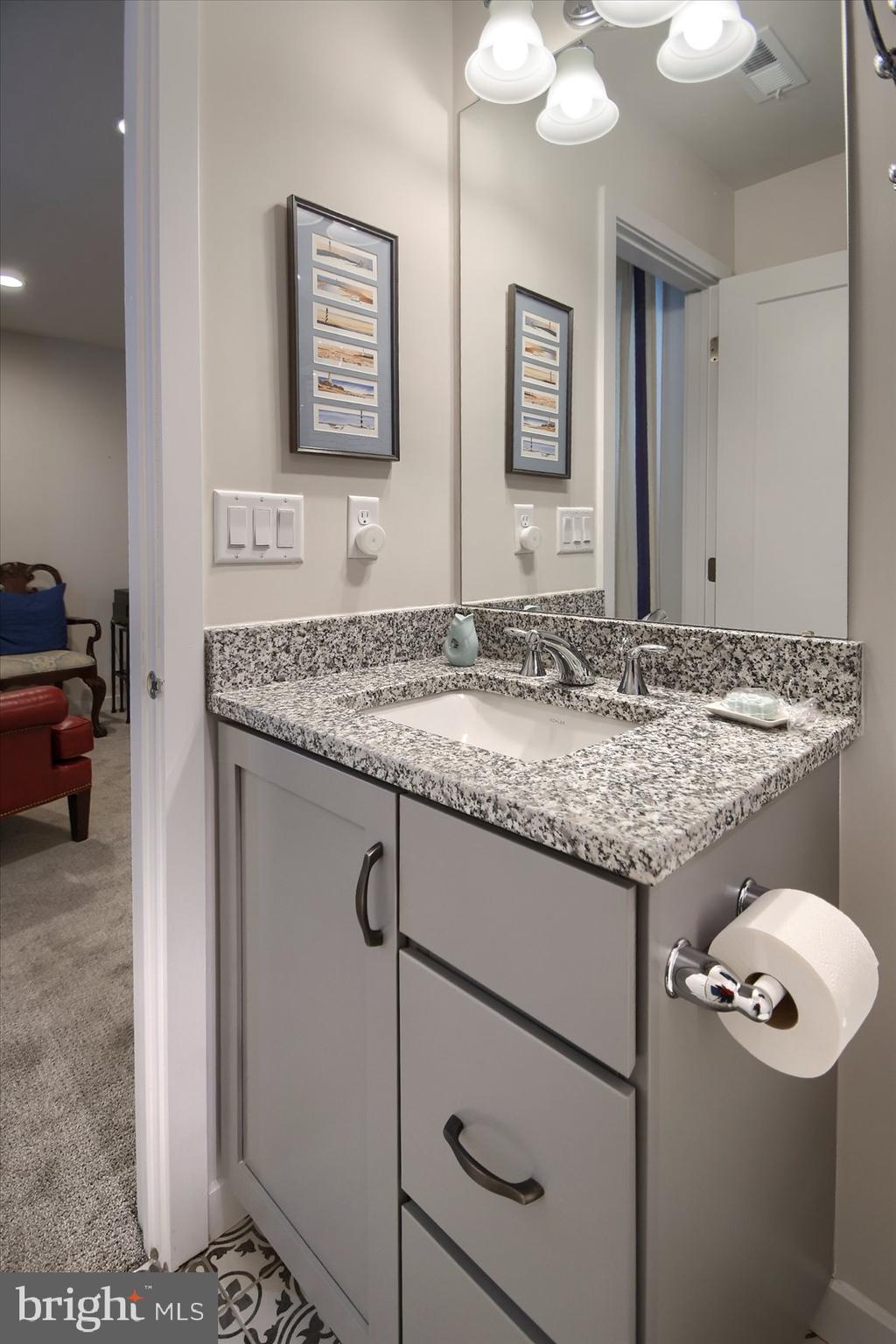 6963 Maple Drive Bath, PA 18014 - Photo 36 of 46 a bathroom with a granite countertop sink and a mirror