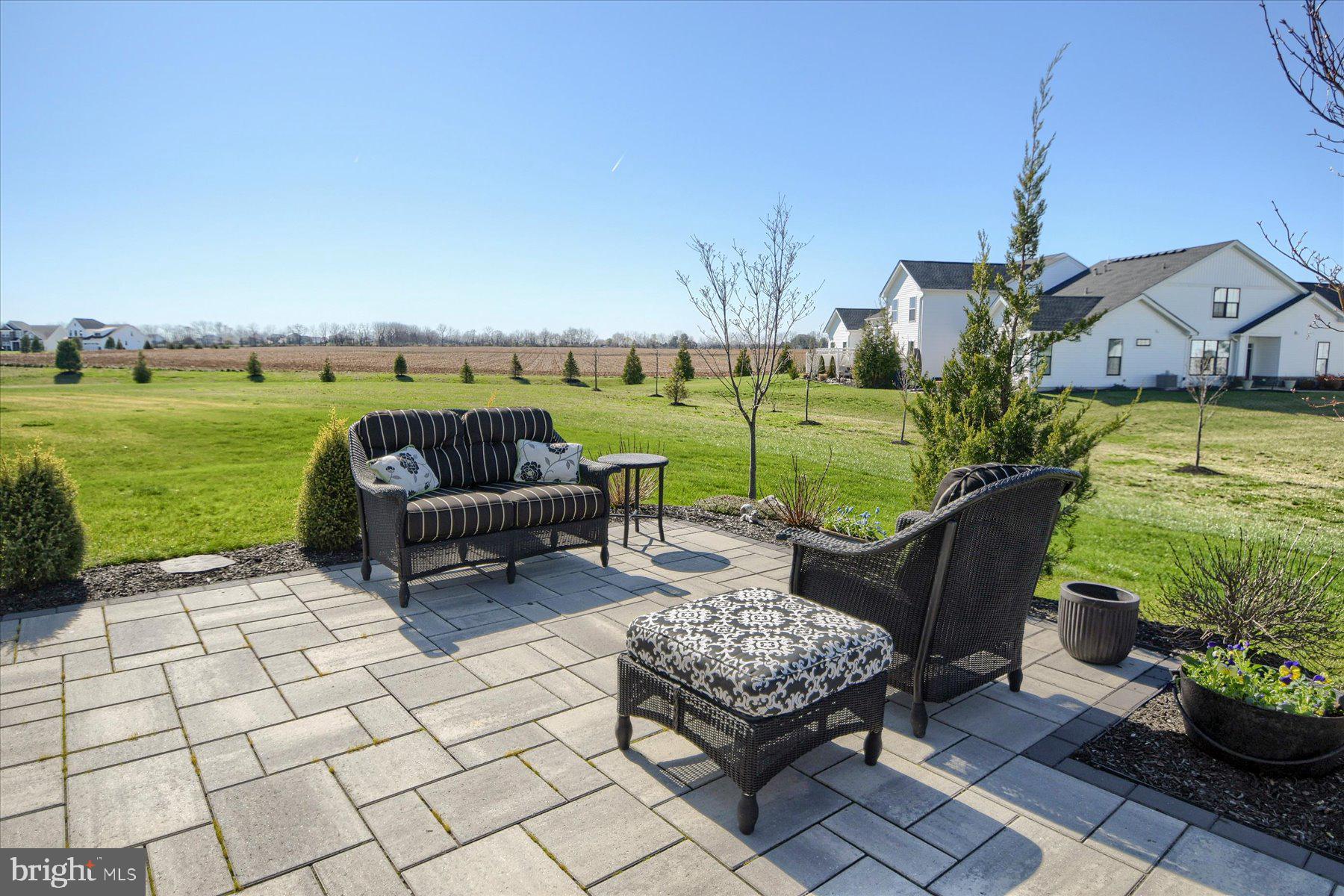 6963 Maple Drive Bath, PA 18014 - Photo 43 of 46 a view of a patio with lawn chairs potted plants and a yard