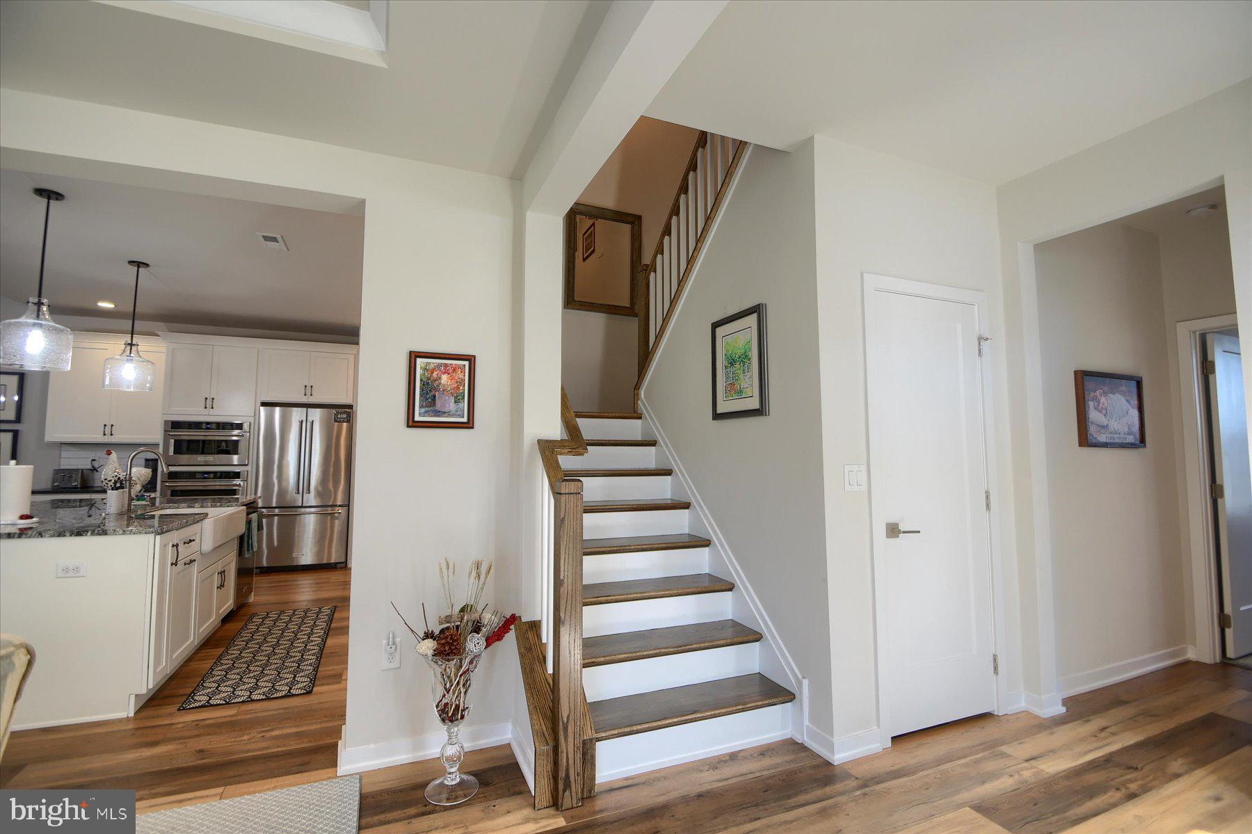 6963 Maple Drive Bath, PA 18014 - Photo 5 of 46 a view of a kitchen with wooden floor and electronic appliances