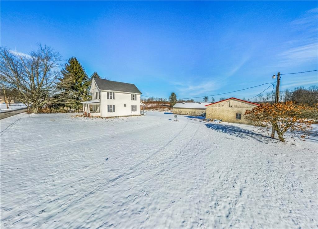 318 Old Ash Road Mercer, PA 16137 - Photo 14 of 15 a view of a house with a yard